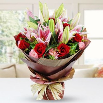 Bunch of 3 Stems of Pink Lilies, 8 Red Roses & 5 Pink Carnations with fillers in nice wrapping All Rounder