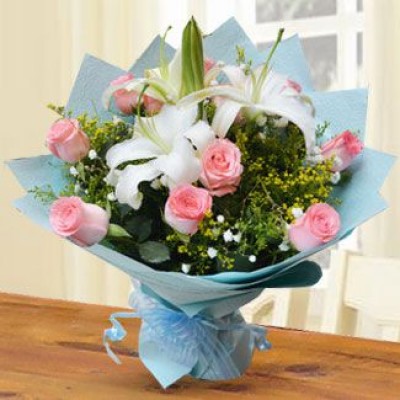 Bunch of 10 Pink Roses & 2 stems of White Lilies with greens and fillers in blue wrapping paper Sweet Stems
