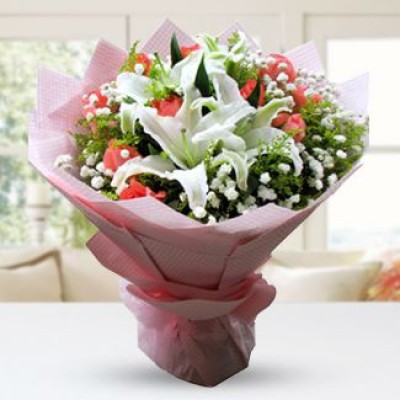 Bunch of 2 stems white lilies and 10 orange roses with fillers in nice wrapping Lilies Decoration