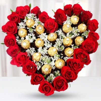 Arrangement of 18 red roses with 16 pcs Ferrero Rocher in Heart shape (As Image) Deep Heart Felt