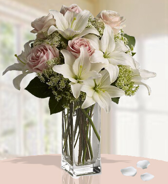Bunch of 2 Stem of White Lilies and 6 Stem of Peach Roses with fillers Softly Speaking