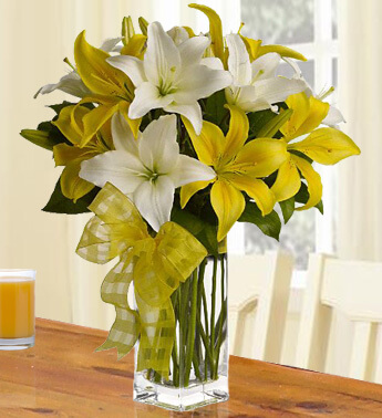 10 Stems of White & Yellow Lilies with fillers in a Glass Vase With Love