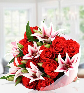 Bunch of 5 Stems of Pink Lilies & 10 stems of Red Roses in nice wrapping Lilies and Roses