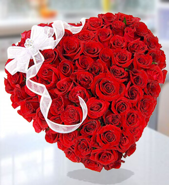 Heart Shape arrangement of 40 Red Roses with fillers with a white bow ribbon Worldwide Romance of Rose