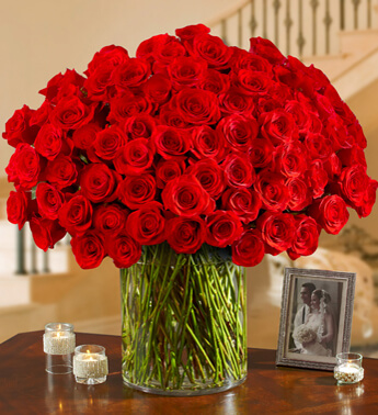 200 Red Roses in a glass vase. Love Struck