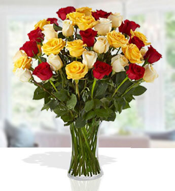 12 Red, 12 Yellow and 12 White Roses in a glass vase. Sensational Color