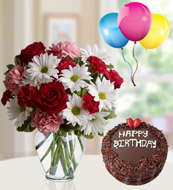 6 Red Roses , 6 Peach Carnations & 3 stems of White Chrysanthemums in a glass Vase (one sided round arrangement) with 1 Kg Chocolate Cake and 3 Latex Balloon All is Fair In Love Gift