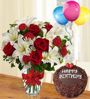 Bunch of 6 Red Carnation, 6 stems of White Chrysanthemum, 4 stems of White Lily, 8 Red Rose with 1Kg chocolate Cake and 3 Latex Balloon From My Heart